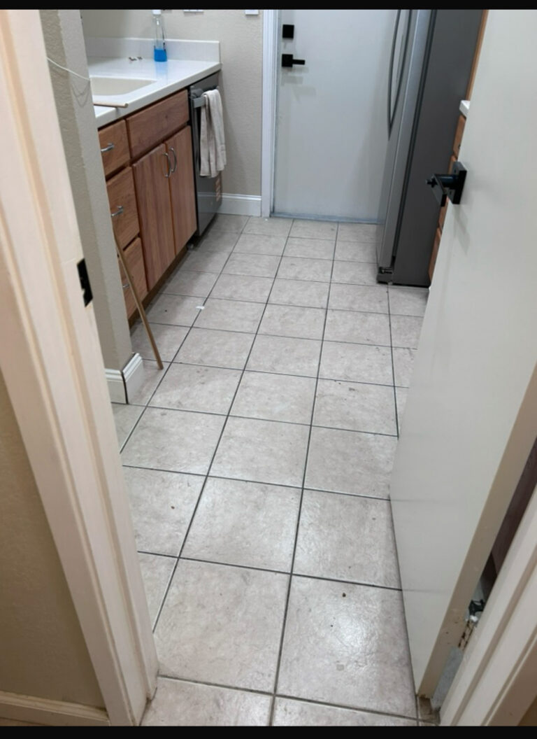 Old damaged flooring before kitchen remodel San Jose