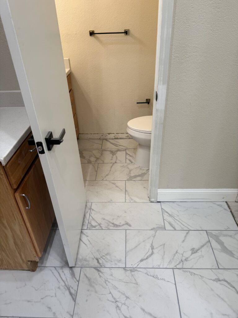 Finished custom tile floor transformation with new baseboards San Jose