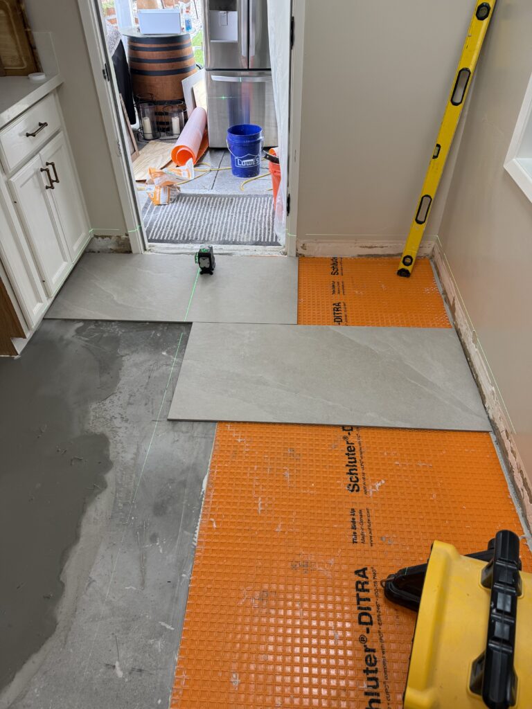 Schluter-DITRA uncoupling membrane installation for tile waterproofing