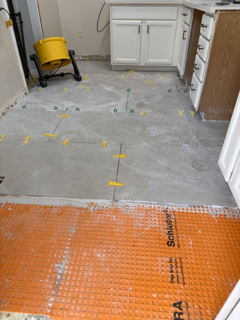 Thin-set mortar application over waterproofing membrane