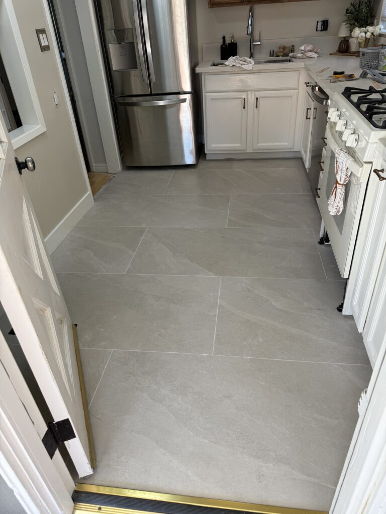 Finished large format porcelain tile installation in modern kitchen San Jose