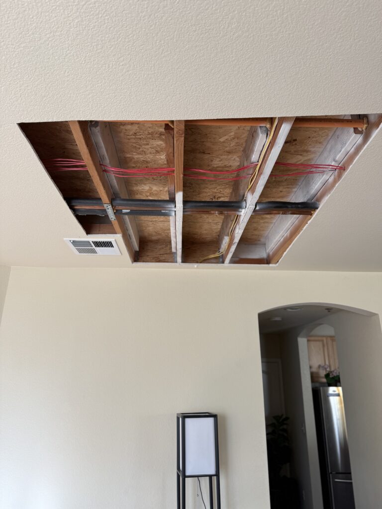 Damaged drywall ceiling with cracks and holes before repair San Jose