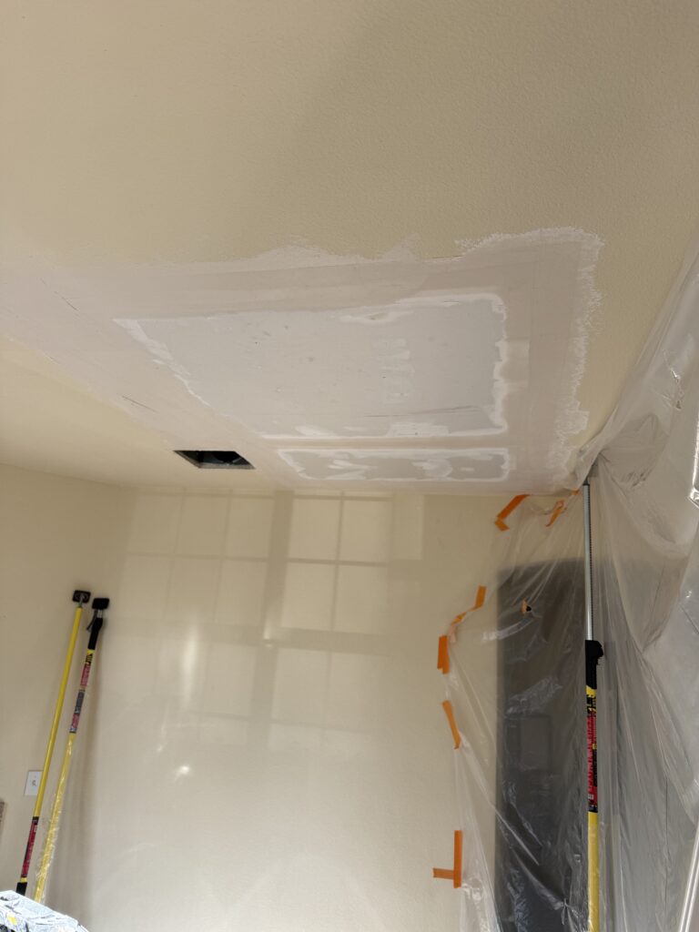 Professional drywall taping and mudding process for ceiling repair