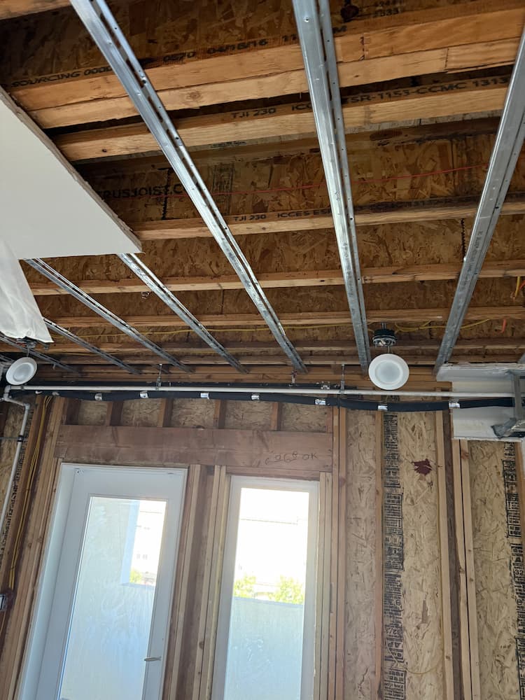Ceiling joists framing and drywall preparation during water damage reconstruction in San Jose, CA