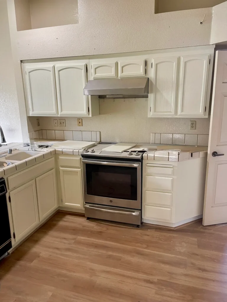 Cabinet painting in a San Jose kitchen: upper and lower cabinets painted a soft white with a smooth, even finish