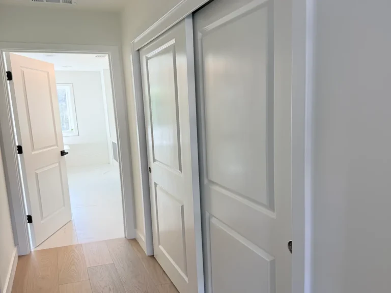 Trim painting in a San Jose home: white panel doors, sliding closet doors, casings and baseboards with crisp lines
