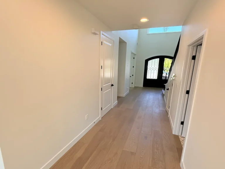 Interior doors painting in a San Jose home: freshly painted hallway walls and ceiling leading to the front door