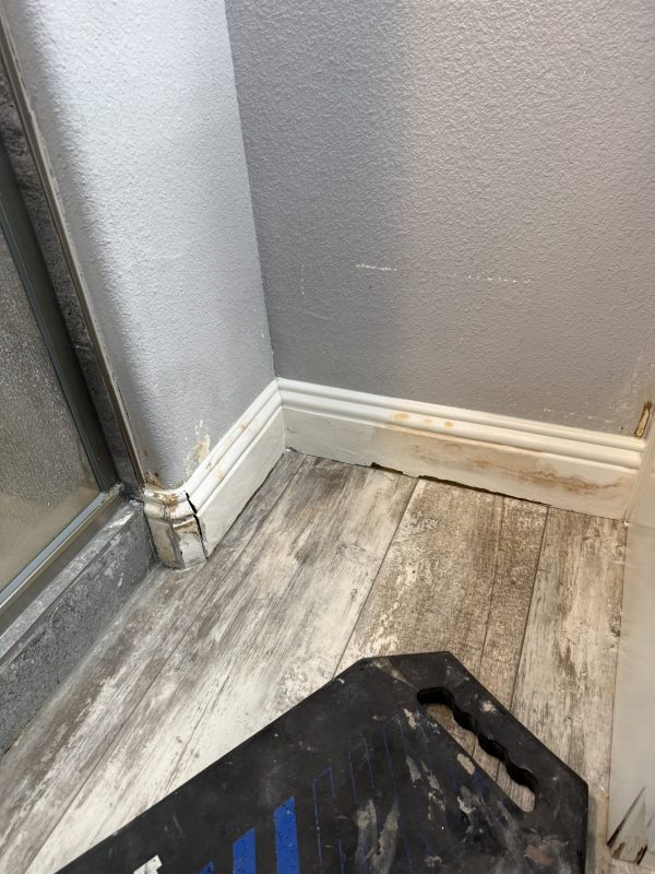 Water damaged flooring removal and baseboard demolition San Jose